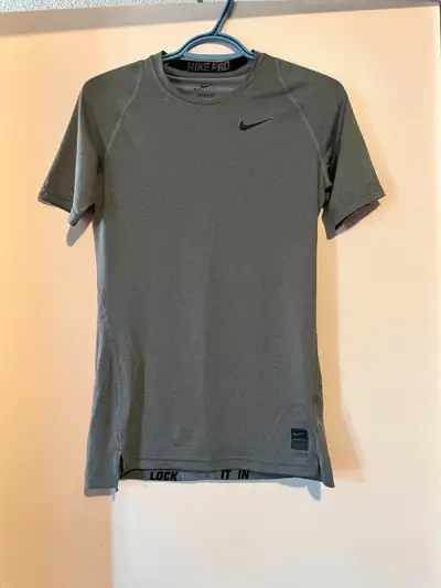 Nike pro tee in excellent like new condition . Super light and cozy , grey tee, logo on front and ta...