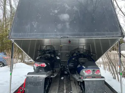 Get ready for the trails with this turn-key winter package featuring two pre-owned Polaris snowmobil...