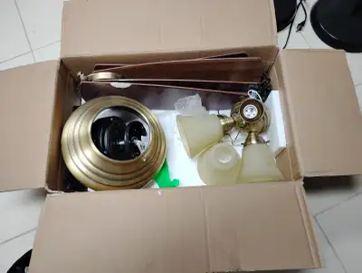 Unassembled ceiling fan kit with light fixtures, which falls under the category of home decor/fixtur...