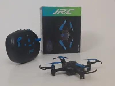 A lightly used JJRC toy remote controlled drone in its original packaging. The remote controller req...