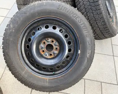 4 Bridgestone Blizzak winter tires on steel rims, in great condition. Size: 225/65R17 102H All bough...