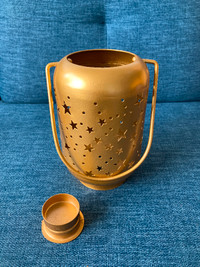 Gold tea light candle lantern with star pattern