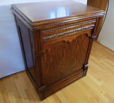 Beautiful Antique sewing machine with Tiger wood cabinet, View more