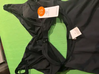 I am selling a new Charmo one-piece swimsuit in black, size medium, perfect for swimming and sunbath...