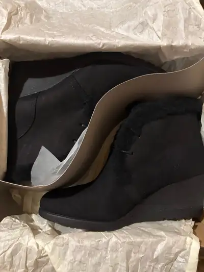 Step out in style with these UGG Jeovana black suede wedge booties, size 8, perfect for adding a tou...