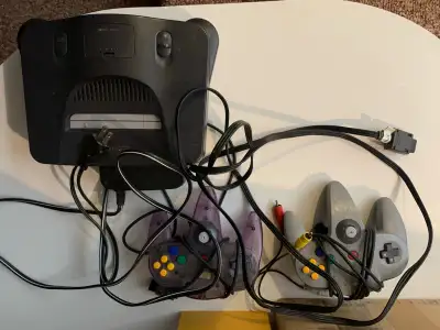 Nintendo 64 w/chords   2 controller   N64 Games.  Check descript, View more