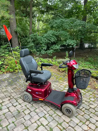 Gently used Scooter with new battery 4 wheel Auriga comes with front basket mirrors and flag