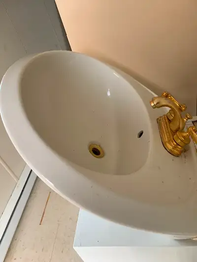 Pedestal sink white with gold tap. Colborne, Ontario