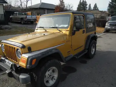 2003 Jeep TJ, 5 speed standard , has new snow tires, excellent condition. Asking $12000. Phone 403-5...