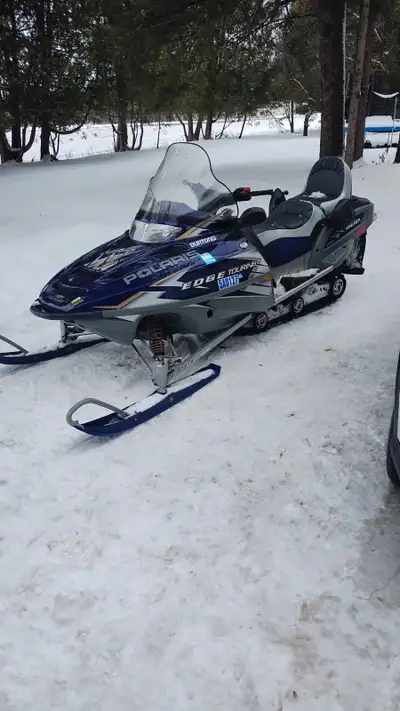 looking to sale a very good working sled its a 2005 polaris edge 600 touring runs very good no probl...