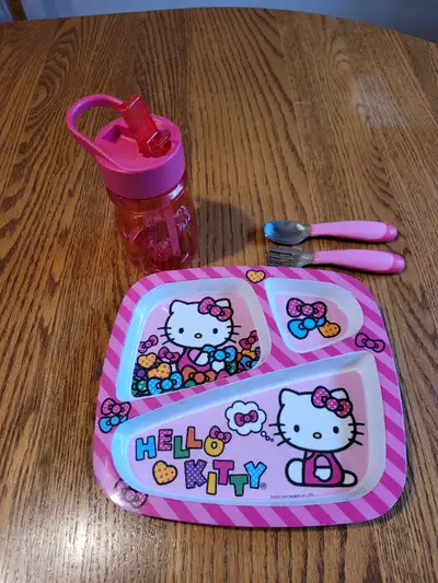 HELLO KITTY TODDLER PLATE, WITH CUTLERY AND SIP CUP in excellent condition, $5.00 From smoke and pet...