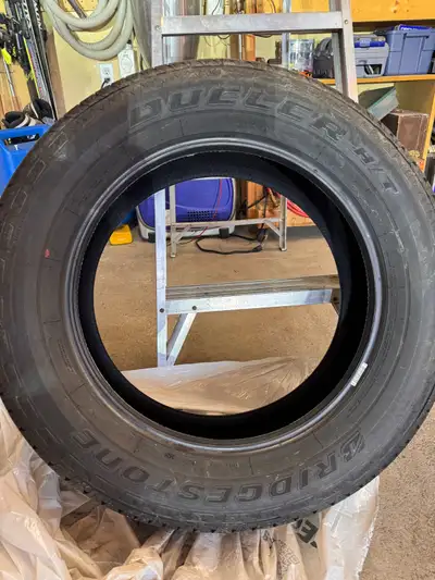 Set of 4 new Bridgestone Dueler H/T tires, size 265/60R20, taken off 2025 Tundra featuring the M+S (...