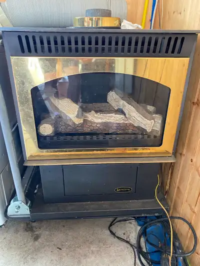 Used gas fireplace with fan sets up to thermostat ready to be picked up