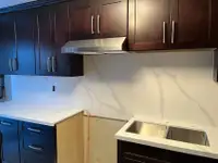 Maple wood cabinets with quartz countertop