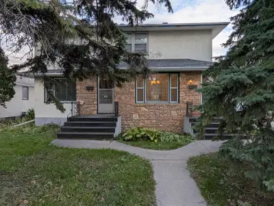 Spacious main floor suite with large living room and kitchen, dedicated dining room, beautiful hardw...