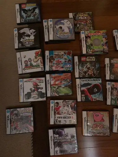Assortment of DS Games and Handheld, View more