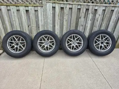 Set of 4 Michelin Snow Tires on Aluminum Rims. Size 245/65/17. Good Condition. Came off Nissan Pathf...