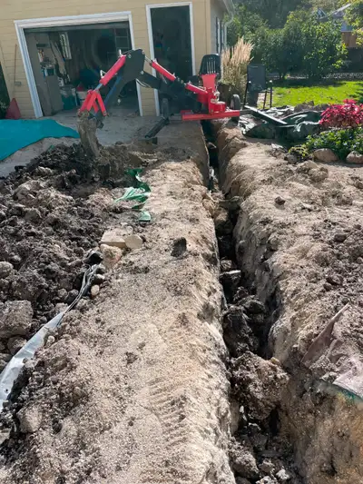 Princess Auto backhoe. Very very handy for tight spaces. It will dig 6 to 7 feet. I have used it for...