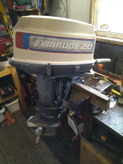 20 HP evinrude had it running in a barrel for abit have video of it running it's old might need some...