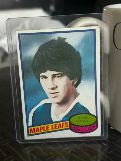 This is a used 1980 O-Pee-Chee Rick Vaive Hockey Card. The card is in good condition for its age. Th...