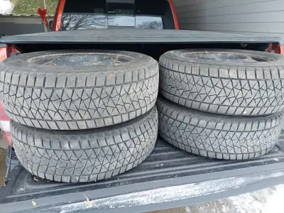Tires and rims from a 2014 Dodge Journey with pressure sensors.