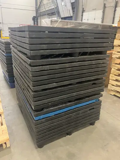 I'm selling a stack of used plastic pallets, perfect for various industrial or storage needs. These...
