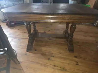 Solid hardwood dining table. Very sturdy/heavy duty with lots of detail work in the base of the tabl...