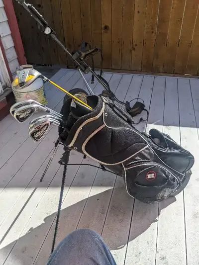 Dirty old bag with balls.. golf clubs
