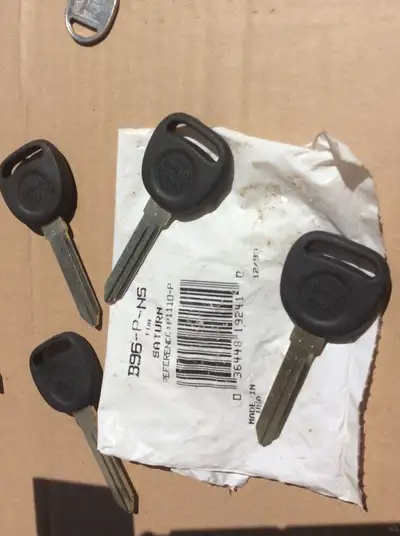 AUTOMOTIVE KEY BLANKS.....FORD VEHICLE NEW TRIM PIECE, CHECK PART NUMBER IN PICTURE...GOLFCART METAL...