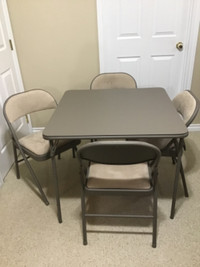 Card table and four padded chairs.  Sand Color.