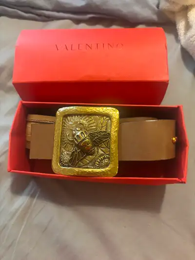 Elevate your style with this stunning, authentic pre-owned Valentino leather belt, featuring a uniqu...