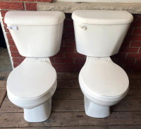 2 like new round bowl toilets