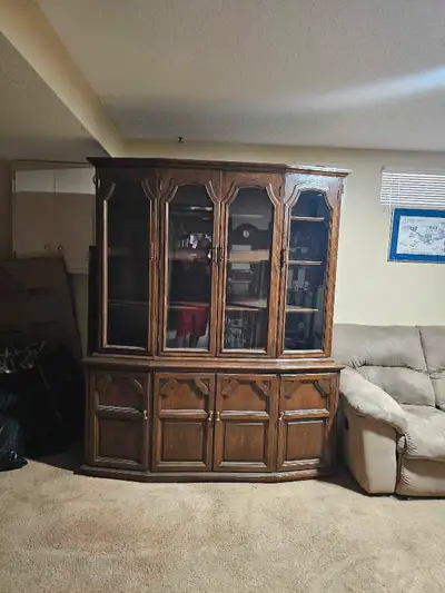 I'm selling a solid wood china cabinet or buffet and hutch. Whatever you want to call it. It has 2 p...
