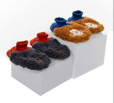 NEW! 2 Pairs of Kid's Soft Sherpa Slippers These cute and cozy slippers are perfect for keeping your...