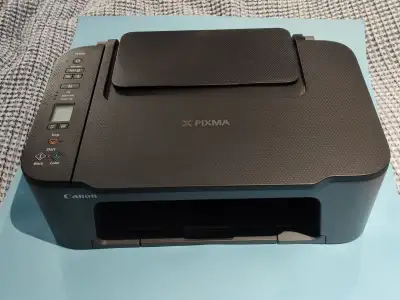 Complete Canon PIXMA TS3420 wireless printer. Has a USB cable and two new 245XL black ink cartridges...