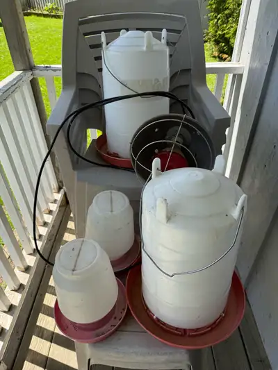 Chicken Watering and Feeders with heater lamp. Sold together.