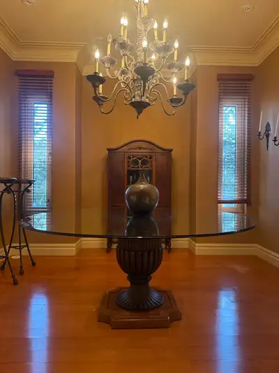 1. Large traditional pedestal dining table with a thick beveled glass top and an ornate carved urn-s...