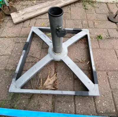 This is a sturdy, metal umbrella base. It is used, but in good condition and ready to support your p...
