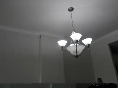 dining room / entryway stainless Steele light fixture in mint condition, can put 3 more bulbs in the...
