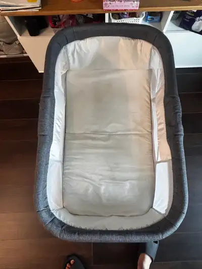 Grey baby bassinet with wheels, View more