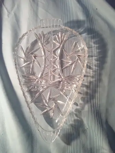 This is a lovely vintage crystal glass dish, perfect for adding a touch of elegance to any table set...