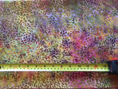 8 separate pieces of new batik fabric. Each piece is a minimum of 1 yard in length (some are a meter...