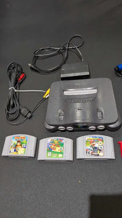 Includes: N64 2 controllers 2 memory cards Super Mario 64 Mario Kart 64 Diddy Kong Racing Pickup in...