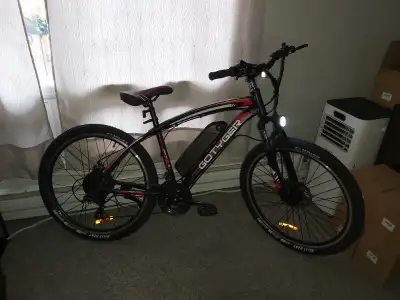 21 speed E Mountain Bike is an open box with some very minor scuffs. Its still in brand new conditio...