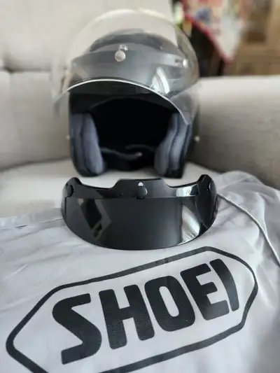 Grey Shoei helmet Never worn. Comes with 2 visors and bag. Size Large 7 3/8-7 1/2" (59-60cm)