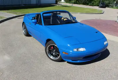 Mariner blue Miata restomod with 313 HP and 272 ft-lb torque at the rear wheels. The vehicle has 272...