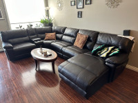 Leather sectional with power recliner and interchangeable.