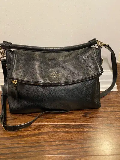 Excellent used condition Kate Spade leather bag. With top handle long enough for shoulder, and remov...