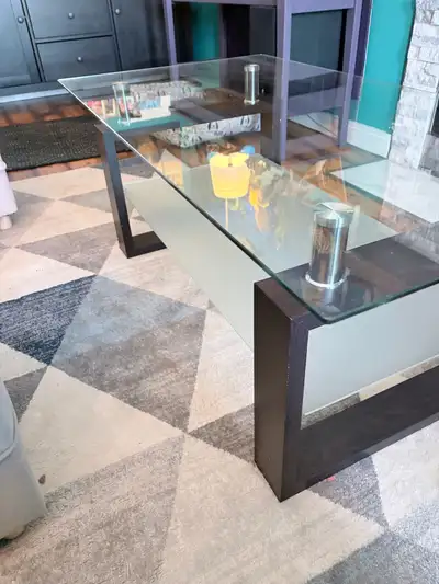 This glass-topped coffee table and matching end table are perfect for adding a touch of elegance to...