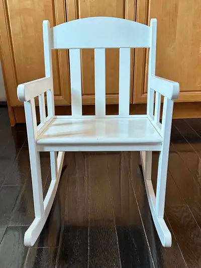 IKEA kid’s rocking chair, white, solid wood, in great condition . Size is 22.5 inches high at back,...